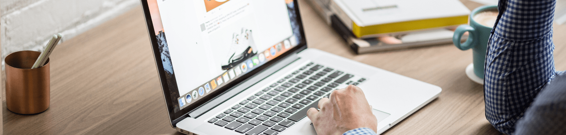 Person working on a macbook laptop