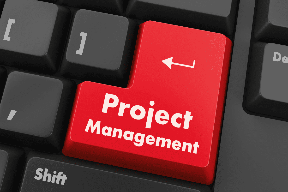 computer "enter" key with the words "project management" written on it.