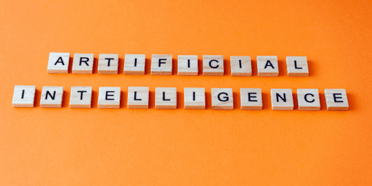 Image with the words "Artificial Intelligence" written across with an orange background