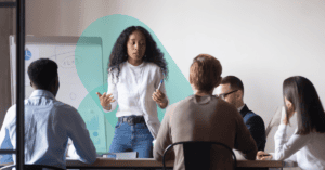 Woman speaking to a team.